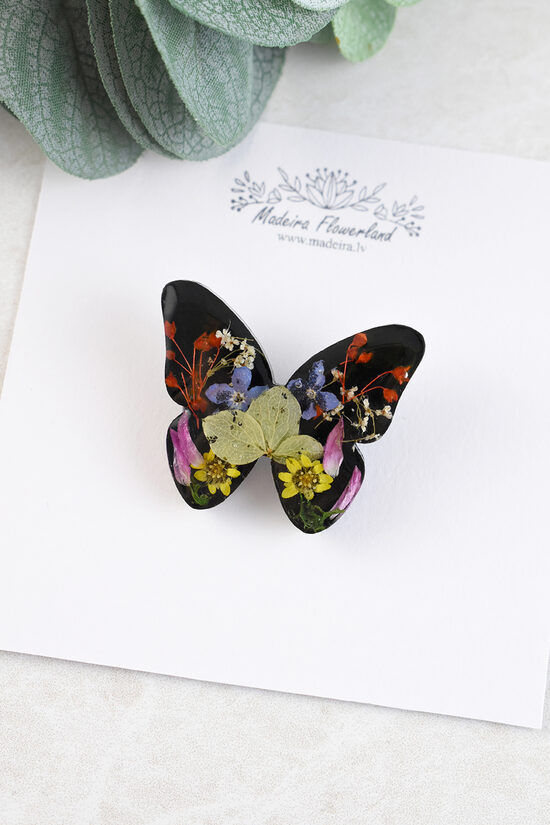 Black butterfly lapel pin
