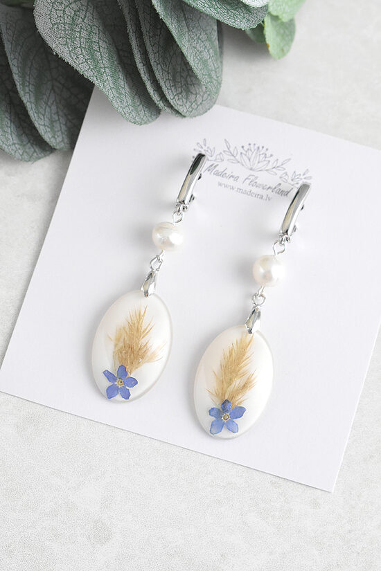 White earrings with a natural pearl