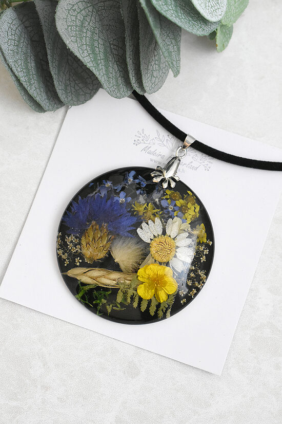 Pendant with meadow flowers
