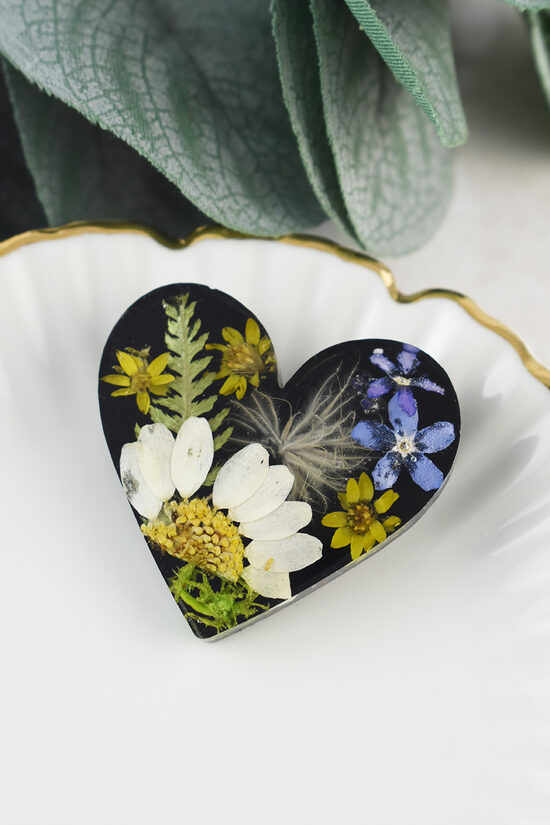 Black brooch with flowers