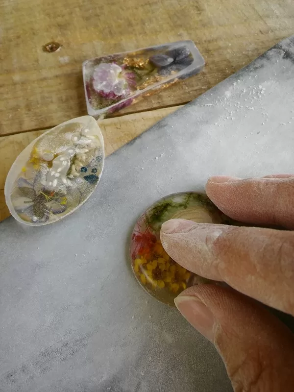 Sanding resin pieces with sandpaper